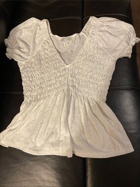 Smocked Eyelet Peplum Blouse in White by Jun & Ivy